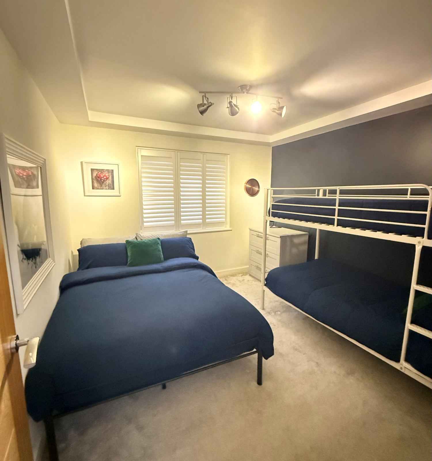 Bedroom with a double bed and bunk beds