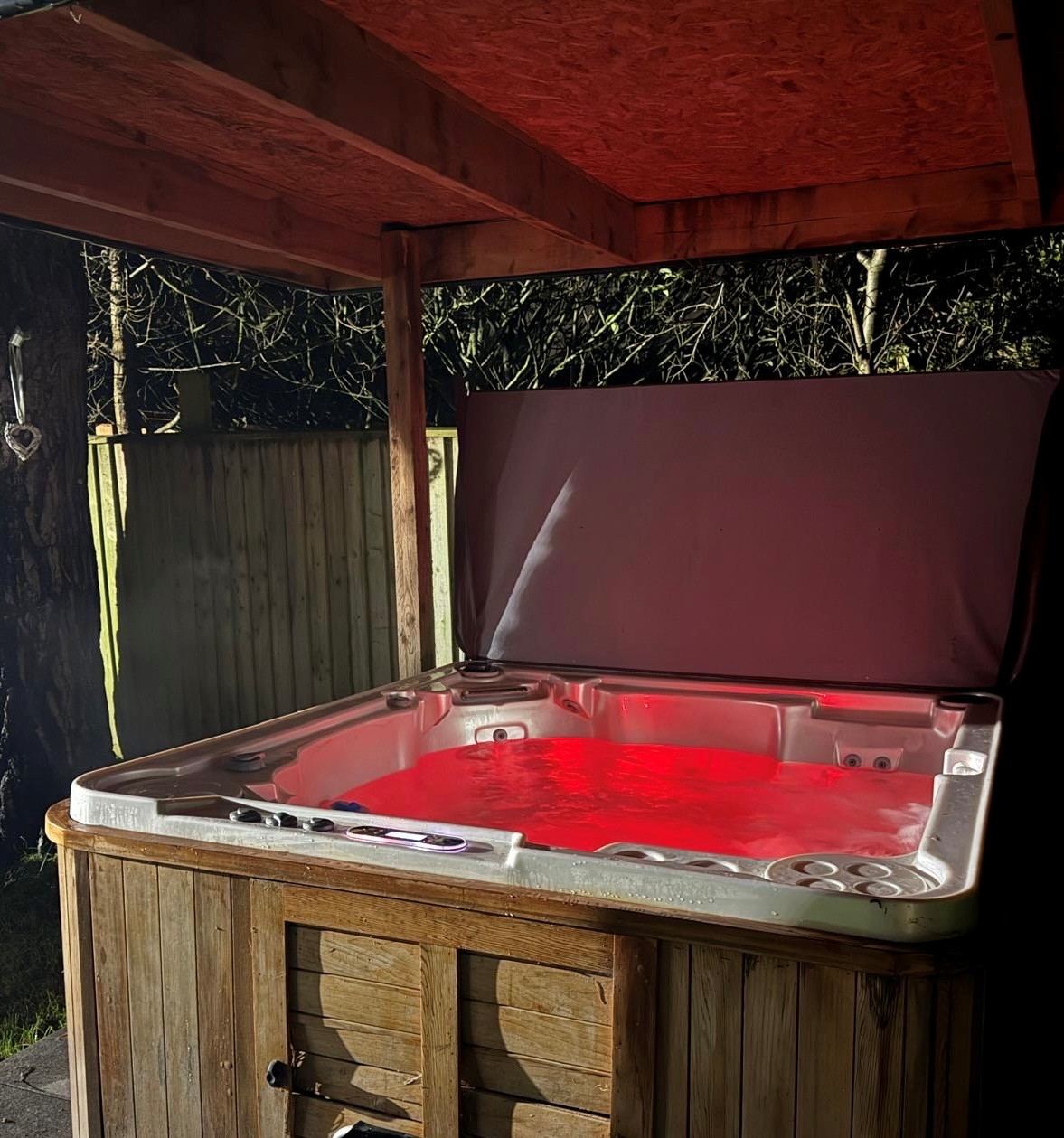 Covered hot tub at night